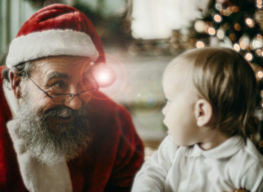 Santa Claus smiling with a child - Toronto Santa Claus Parade